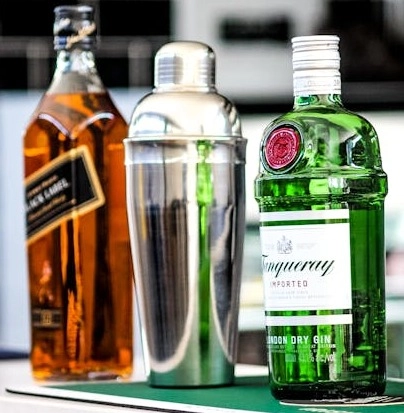 London dry gin and blended Scotch whisky with a cocktail shaker at ABLO Liquor Calgary