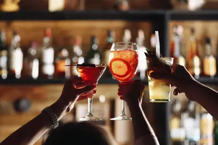Friends toasting cocktails made with drinks from ABLO Liquor Corner Brook, Cornerstone Calgary